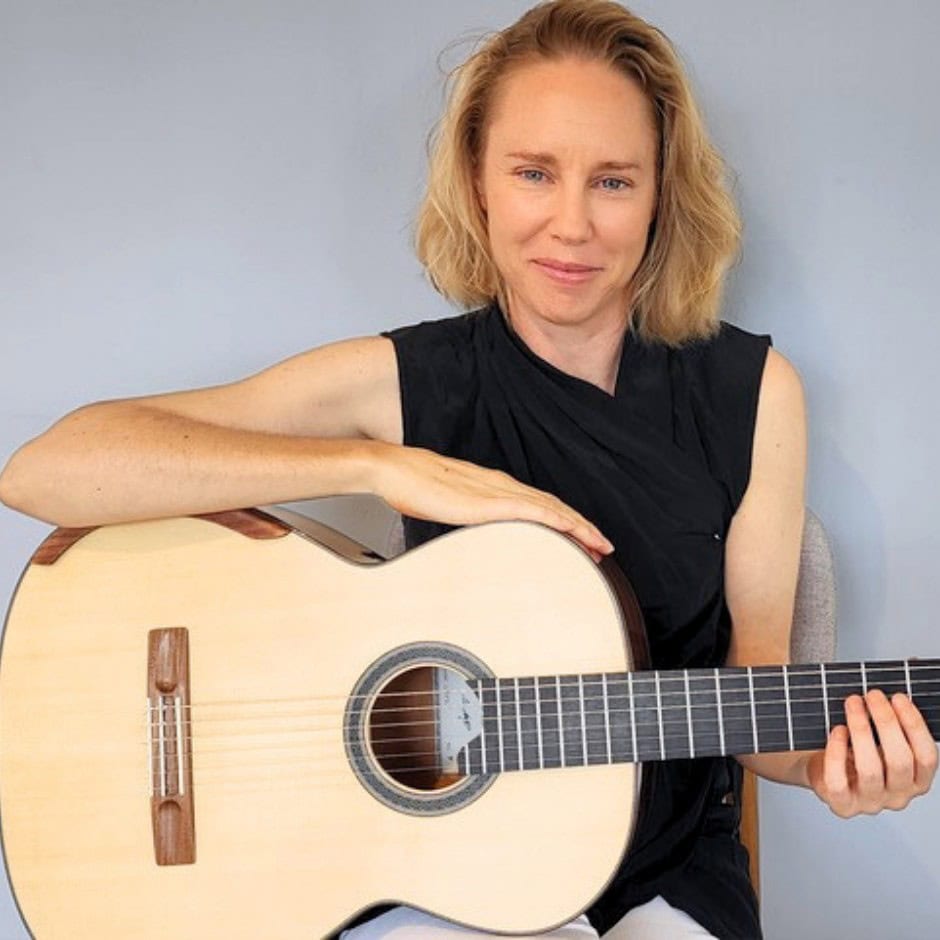 Jane Curry with a classical guitar